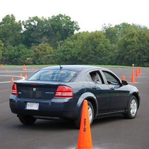 A student drives a car in a training course at the Alabama Traffic Safety Center.